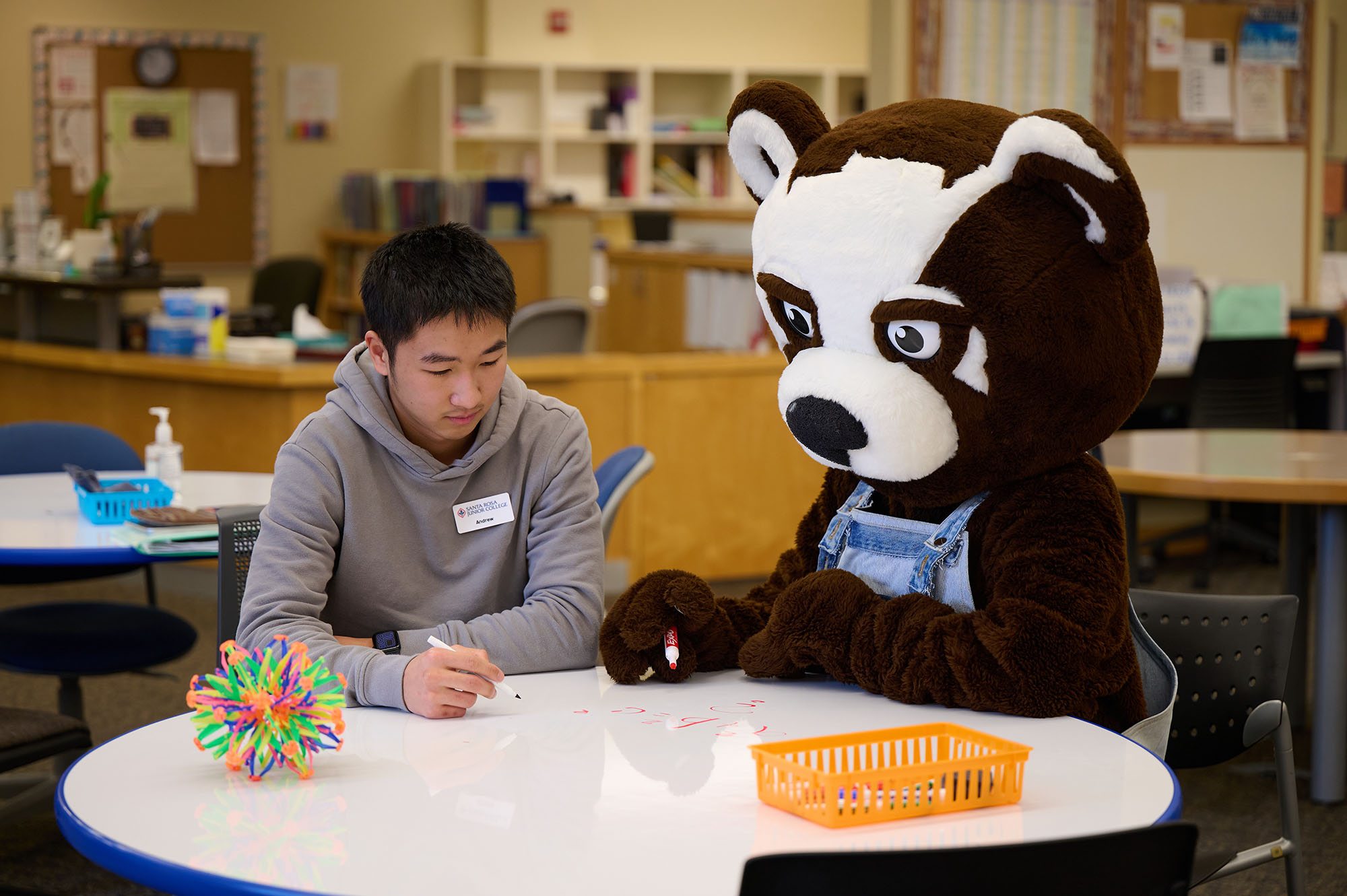 Rosco bear with a continuing student